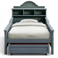 Gray bed with headboard featuring built-in niches and a base with a drawer, part of Ovendraq's Collections furniture line.