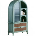 Green and beige vitrina with arched top and woven drawers from Ovendraq Collections, showcasing a stylish storage cabinet.